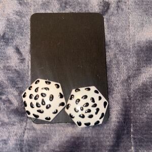 White earrings with black overlay